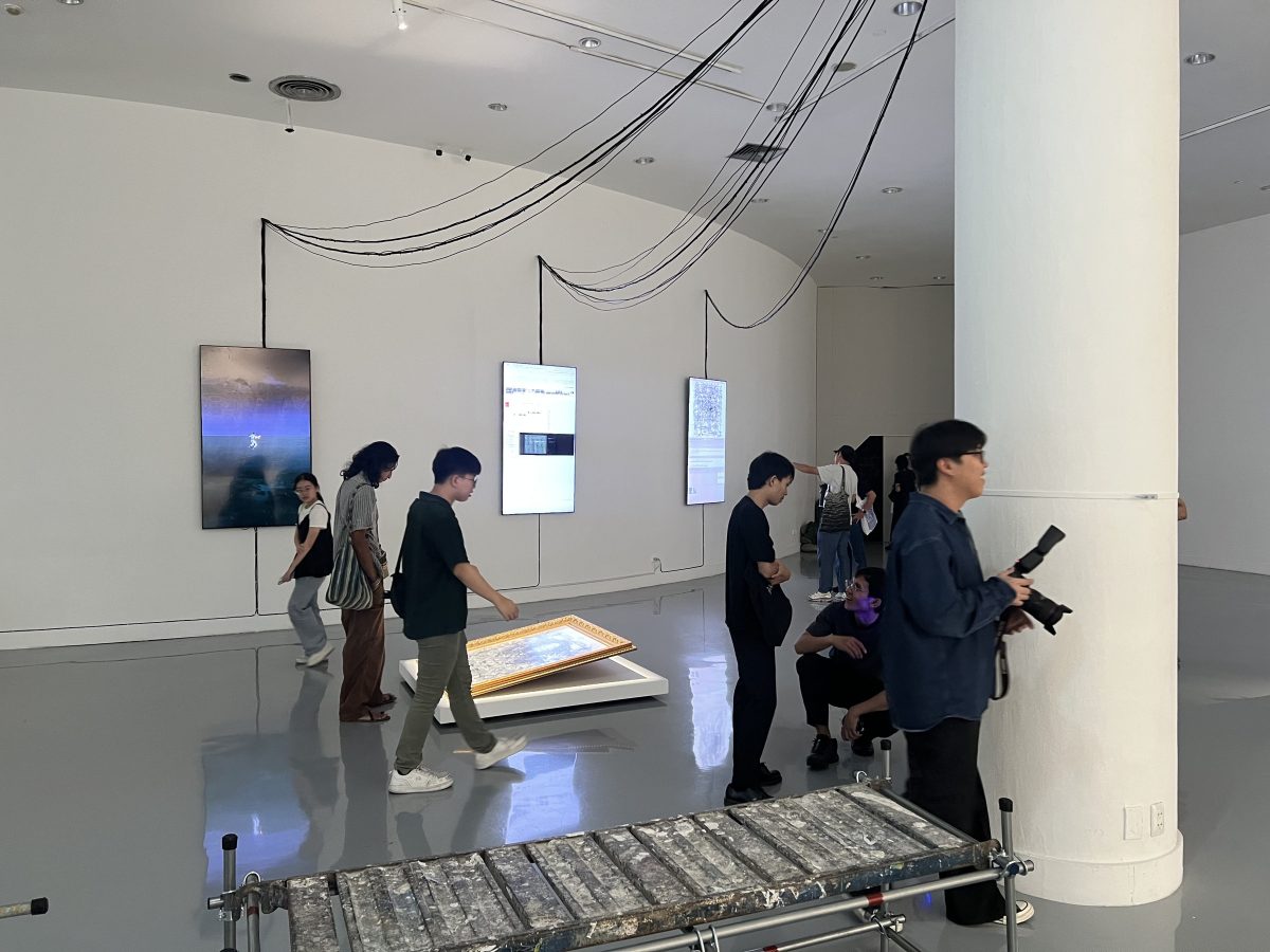 Visitors around the framed map